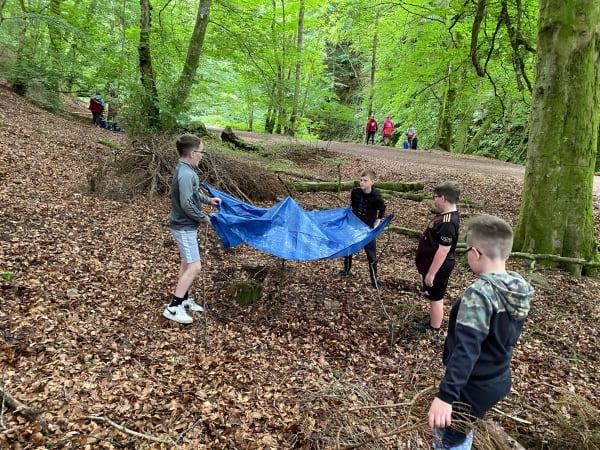 shelter building with tarp with Alyth Youth Partnership