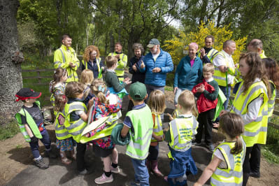Mountaineer Cameron McNeish cutting the ribbon to open the path with project partners and local Kinloch Rannoch Primary School pupils © Ian Biggs