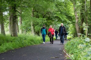Nina Gillespie of Tactran, Julia Howe of the Auchterarder Core Paths Working Group, and Daryl McKeown of PKC Traffic Services walk the opened path ©PKCT