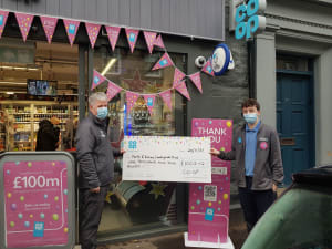 PKCT Trust Director Peter Quinn receives £1000 cheque from Grant at the Dunkeld Co-op © Co-op